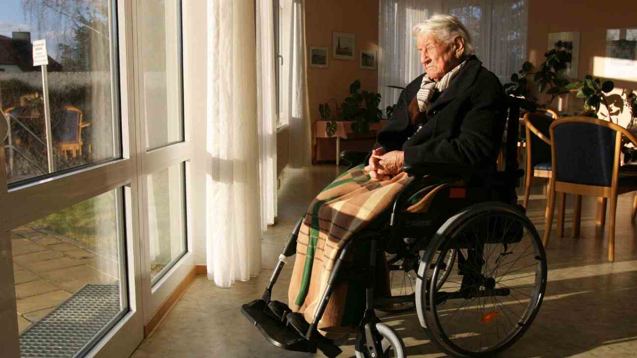 Elderly woman sitting on chair